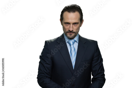 Rich well-dressed businessman. Portrait of serious handsome boss isolated on white background.