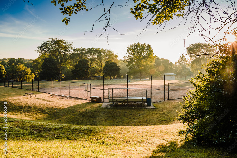 foggy sunrise at a baseball field in a municipal park