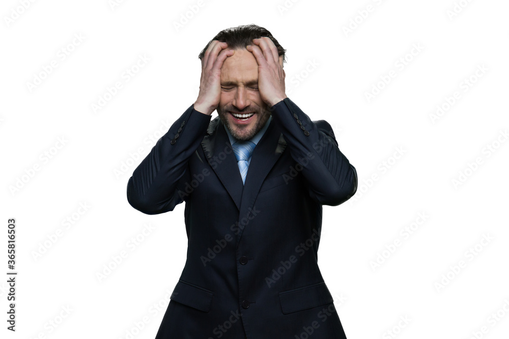 Middle-aged manager is crying. Formal-dressed mature man in suit isolated on white background. Middle-aged manager is crying. Formal-dressed mature man in suit isolated on white background.