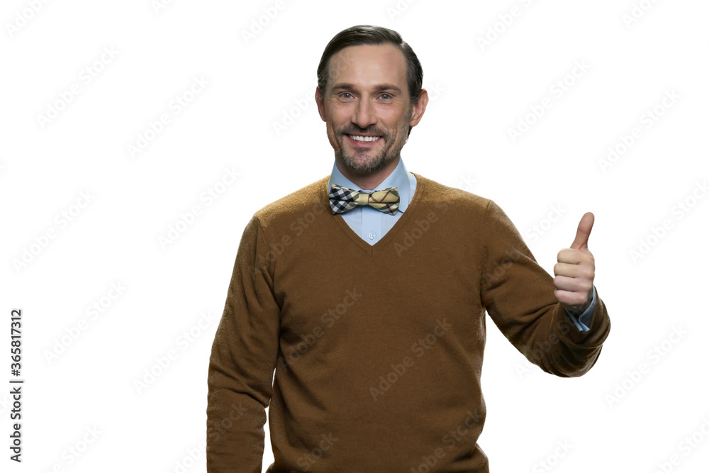 Fototapeta premium Positive middle-aged man in browm sweater with bowtie. Caucasian casual-dressed man isolated on white background.