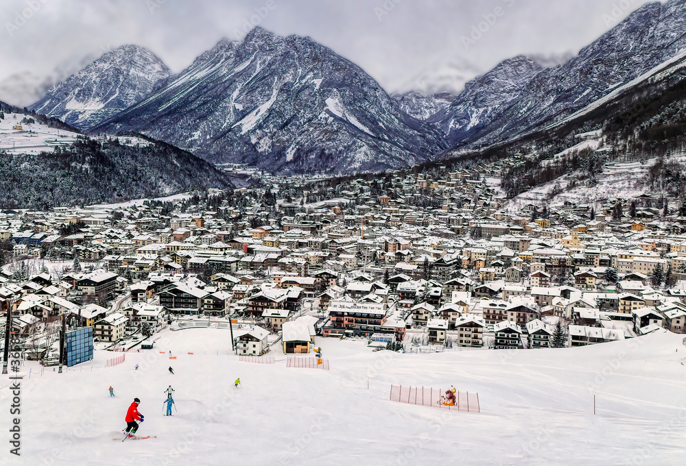 Panoramically view over famous ski town during cloudy winter day in Bormio, Italy.