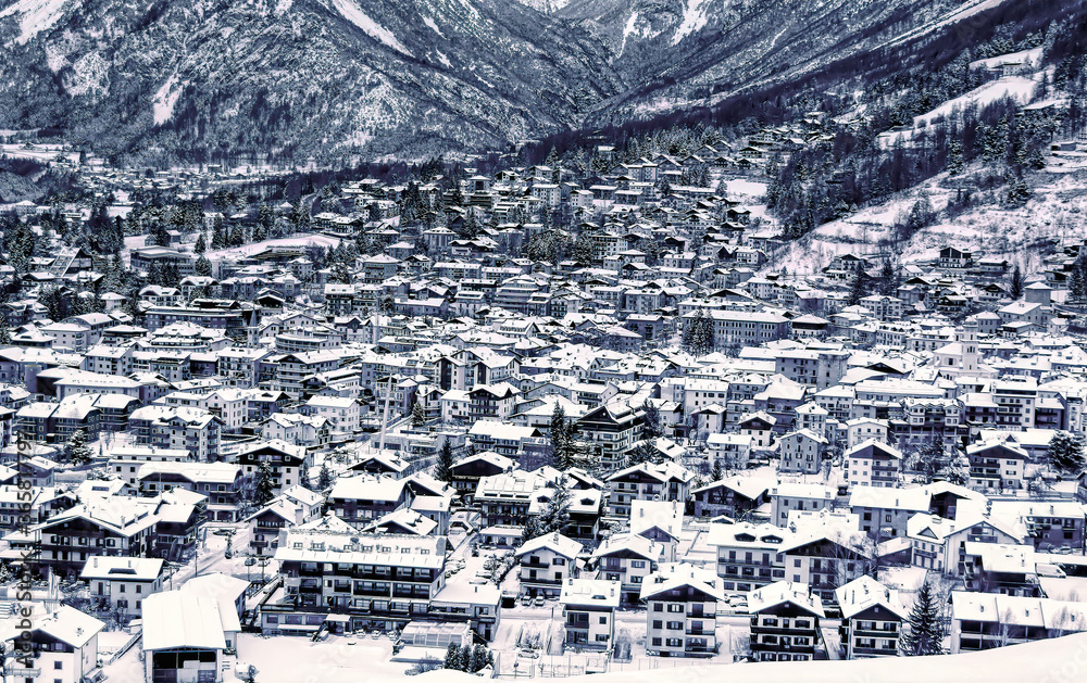Panoramically view over famous ski town during cloudy winter day in Bormio, Italy.