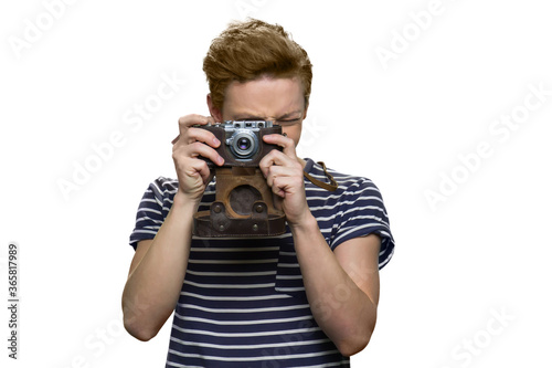 Portrait of young guy taking a photo. Isolated on white background.