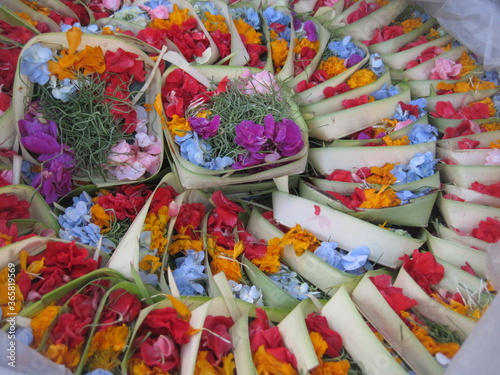 Balinese traditional flower offerings in small basket
