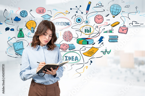 Woman taking notes, online business