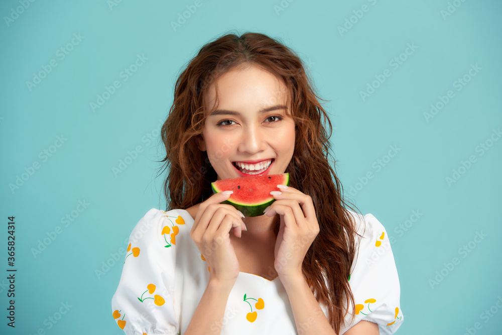 Portrait happy young Asian woman is holding slice of watermelon, funny and happiness concept Portrait happy young Asian woman is holding slice of watermelon, funny and happiness concept
