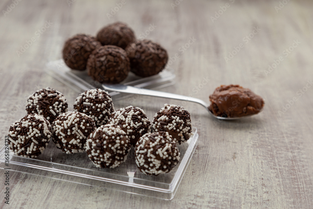 chocolate candies on a wooden table chocolate candies on a wooden table