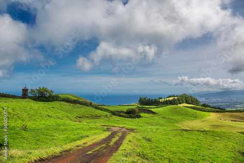 road through green hills landscape on Sao Miguel island, Portugal © Kushch Dmitry