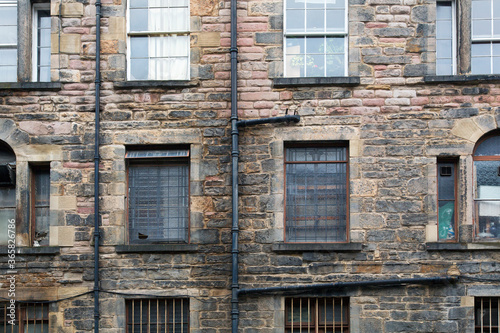 Fototapeta Naklejka Na Ścianę i Meble -  A tenement is a multi-occupancy building of any sort. The term usually refers to a run-down apartment building or slum - Edinburgh,  Scotland.