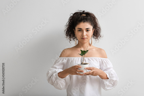 Beautiful young woman with ...
