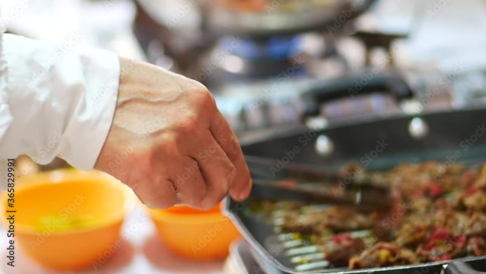 Person take cooking of meat with vegetable grill at home during pandemi. Family concept.