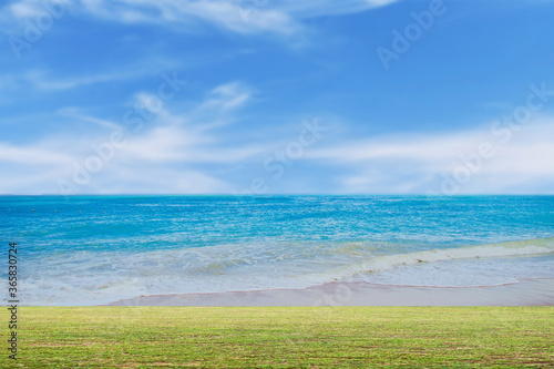 green grass and blue sky with clouds