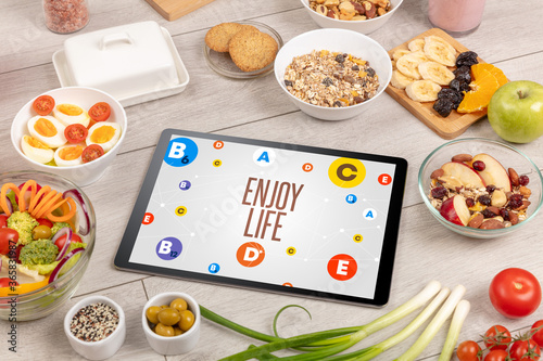 Healthy Tablet Pc compostion with ENJOY LIFE inscription, weight loss concept