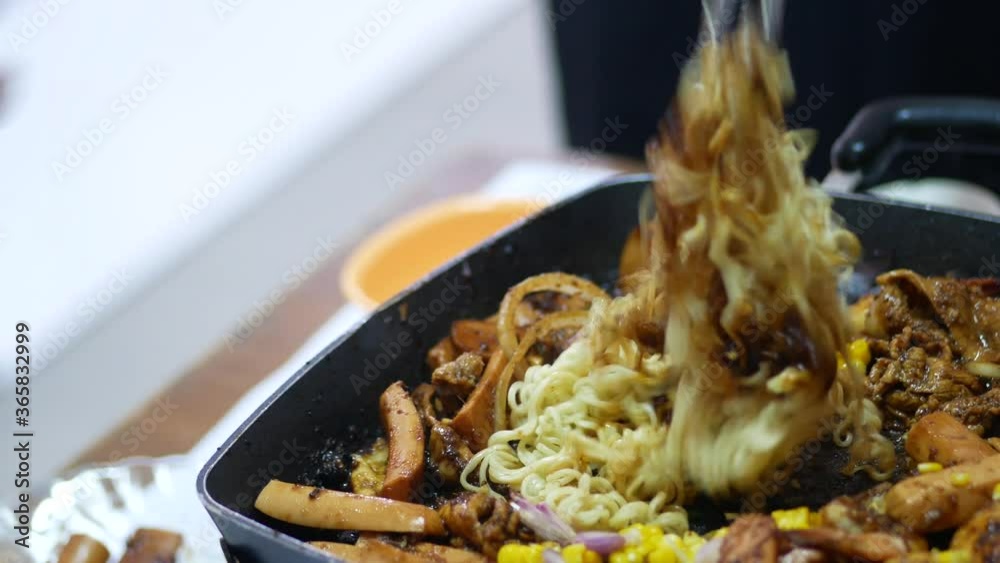 Person take cooking of meat with vegetable grill at home during pandemi. Family concept.