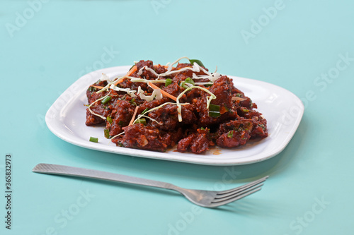 Paneer Tikka Kabab in red sauce - is an Indian dish made from chunks of cottage cheese marinated in spices ,chilli Paneer Kabab, Paneer 65,Spicy cottage cheese