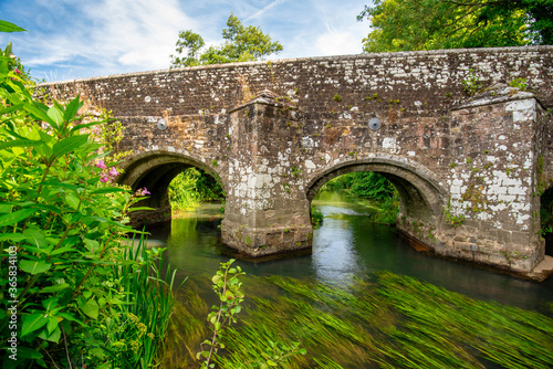 Woolbeding Bridge a medieval bridge over the River Rother in the South Downs National Park, near Midhurst West Sussex.  Restored in 1919, there are less than 200 multispan medieval bridges in England. photo