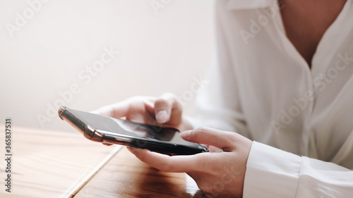 young Asia woman working with smart phone in office.