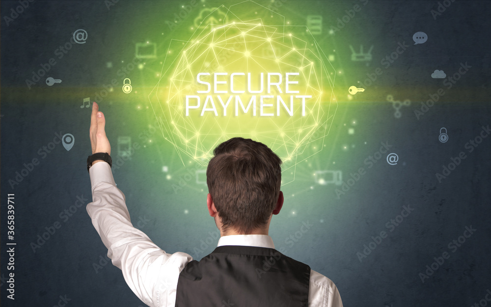 Rear view of a businessman with SECURE PAYMENT inscription, online security concept Rear view of a businessman with SECURE PAYMENT inscription, online security concept