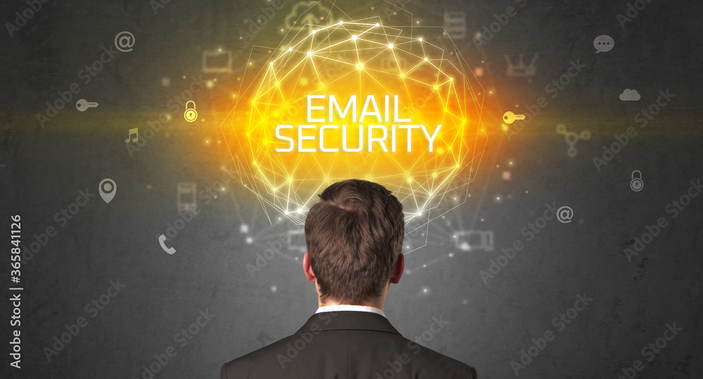Rear view of a businessman with EMAIL SECURITY inscription, online security concept Rear view of a businessman with EMAIL SECURITY inscription, online security concept