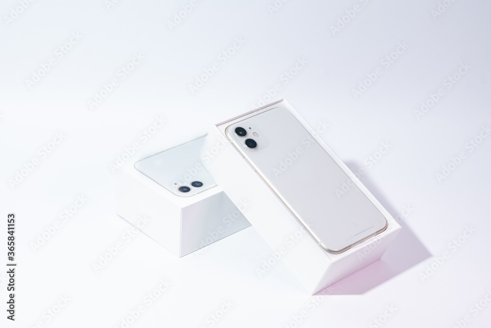 White smartphone with two cameras on a white background White smartphone with two cameras on a white background