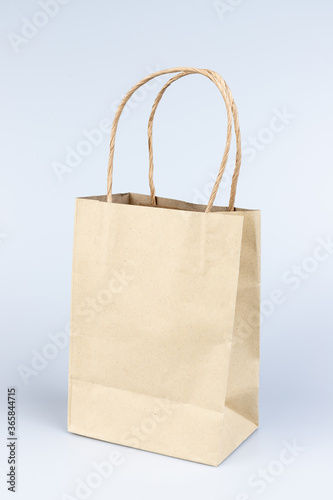 Brown paper shopping bags isolated on white background