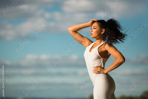 Fototapeta Naklejka Na Ścianę i Meble -  beautiful young woman in sportswear at workout in summer
