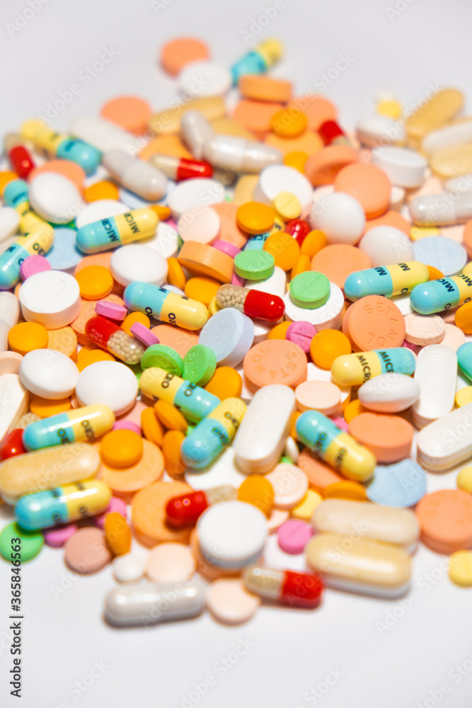 Colorful drugs, vitamins and medicine - capsules, tablets, pills - against white background Colorful drugs, vitamins and medicine - capsules, tablets, pills - against white background