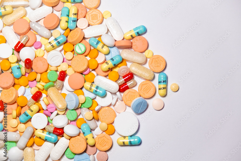 Colorful drugs, vitamins and medicine - capsules, tablets, pills - against white background Colorful drugs, vitamins and medicine - capsules, tablets, pills - against white background
