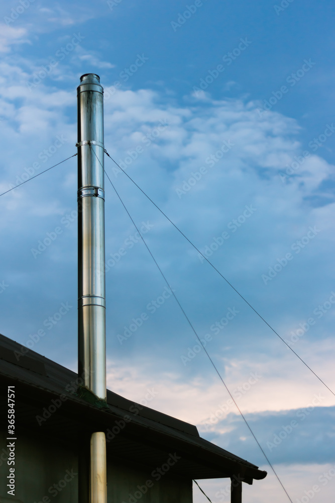 Stainless steel chimney sandwich on sky background Stainless steel chimney sandwich on sky background