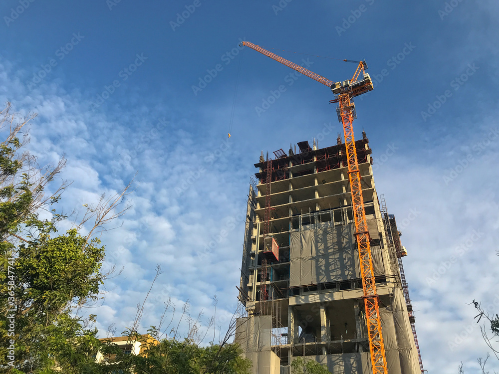 Crane and construction apartment condo building site