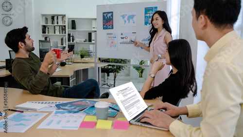 woman speaker giving presentation business partners discussing documents and ideas at meeting and planing in office, brainstorming and teamwork concept