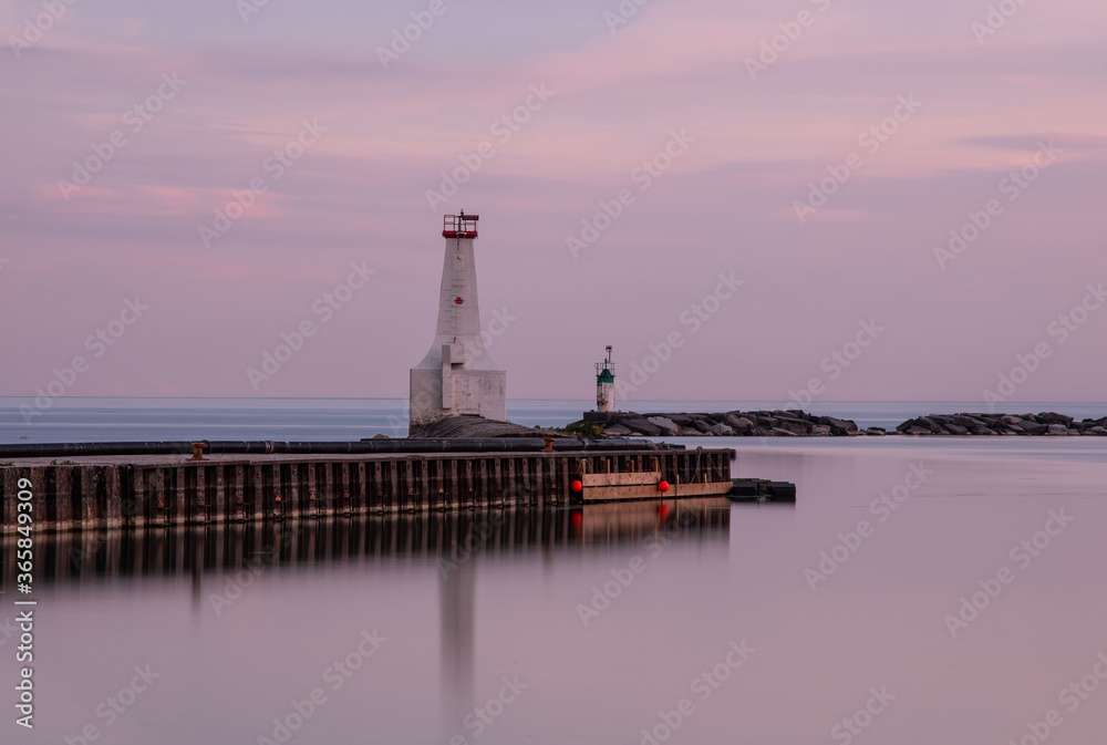 Cobourg pier and lighthouse in sunset Cobourg Ontario Canada