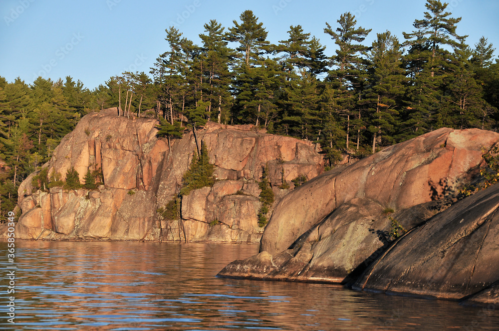 rocky shoreline of George Lake and La Cloche mountains  Killarney Park Ontario Canada