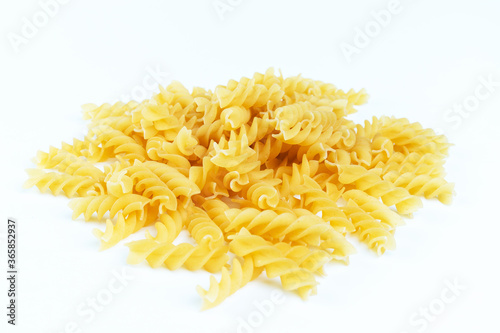 Raw pasta on a white background.