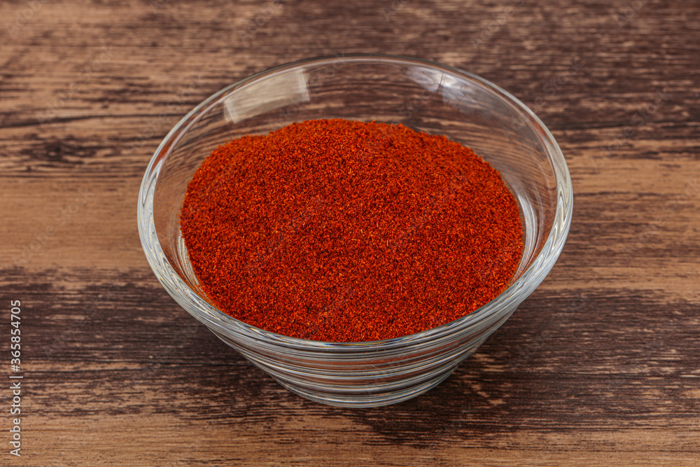 Dry paprika powder in the bowl Dry paprika powder in the bowl
