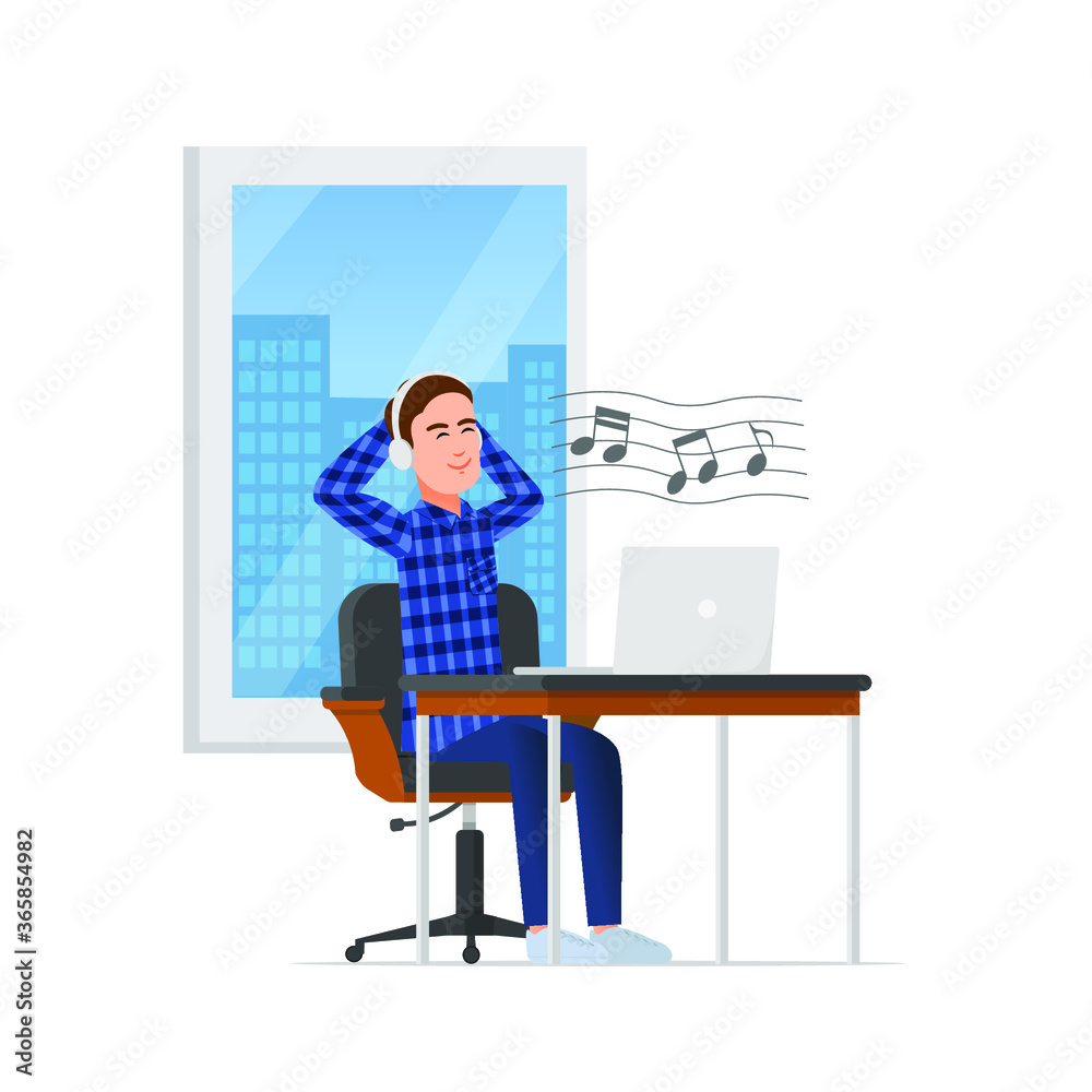 A man sitting in a work chair while listening to music A man sitting in a work chair while listening to music