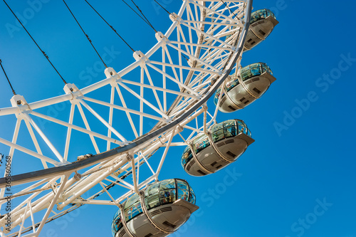 Fotografie, Obraz London Eye against a blue sky