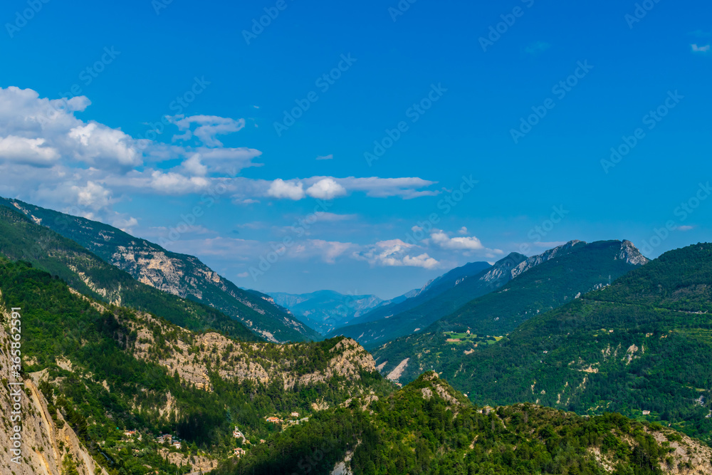 A picturesque landscape view of the French Alps mountains and the valley of river Var (Puget-Theniers, Alpes-Maritimes, France)
