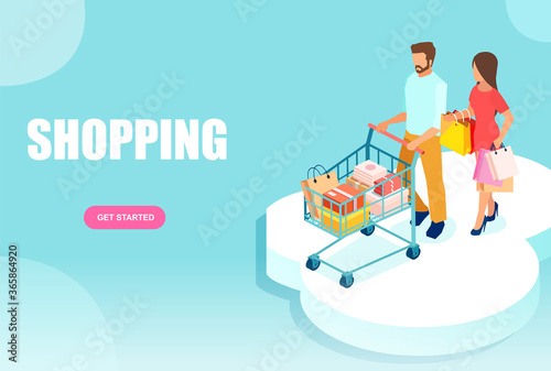 young couple a woman and a man walking with shopping cart and paper bags.