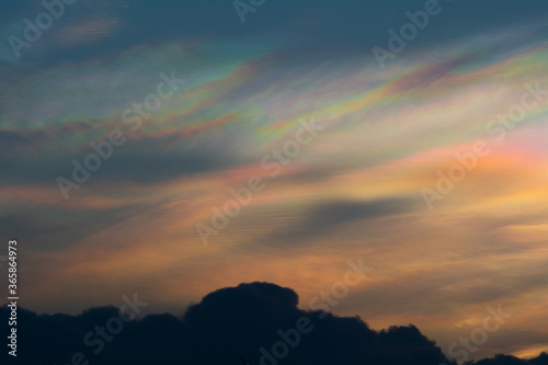 iridescent clouds appear during the sunset.