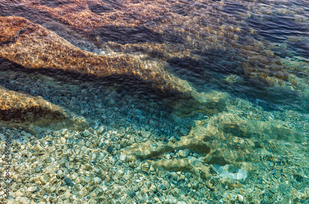 Obraz premium Natural seascape in the Greece. Seascape with rocky beach, turquoise water. Amazing nature Landscape. Wonderful summer day on the Emblisi beach. Kefalovia island.