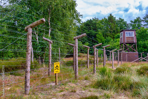 barbed wire fence and watchtower at prison camp Frøslev