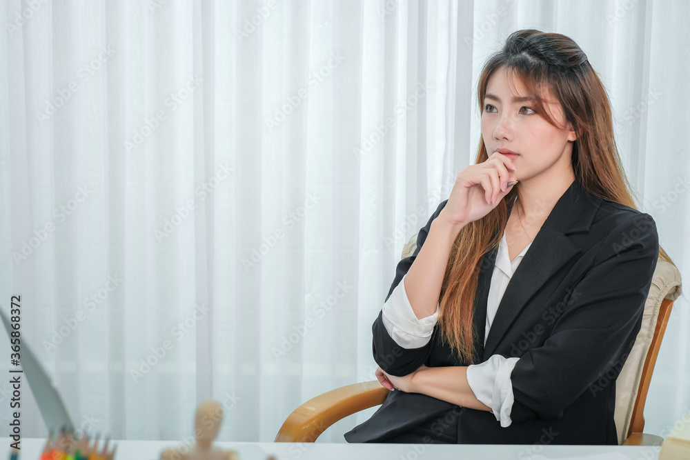 Overworked tired businesswoman sitting in her office. Overworked tired businesswoman sitting in her office.
