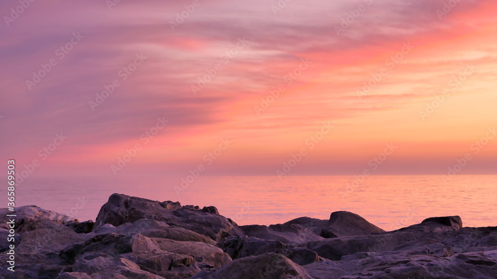 Beautiful pink, orange, purple and red sunset over the sea