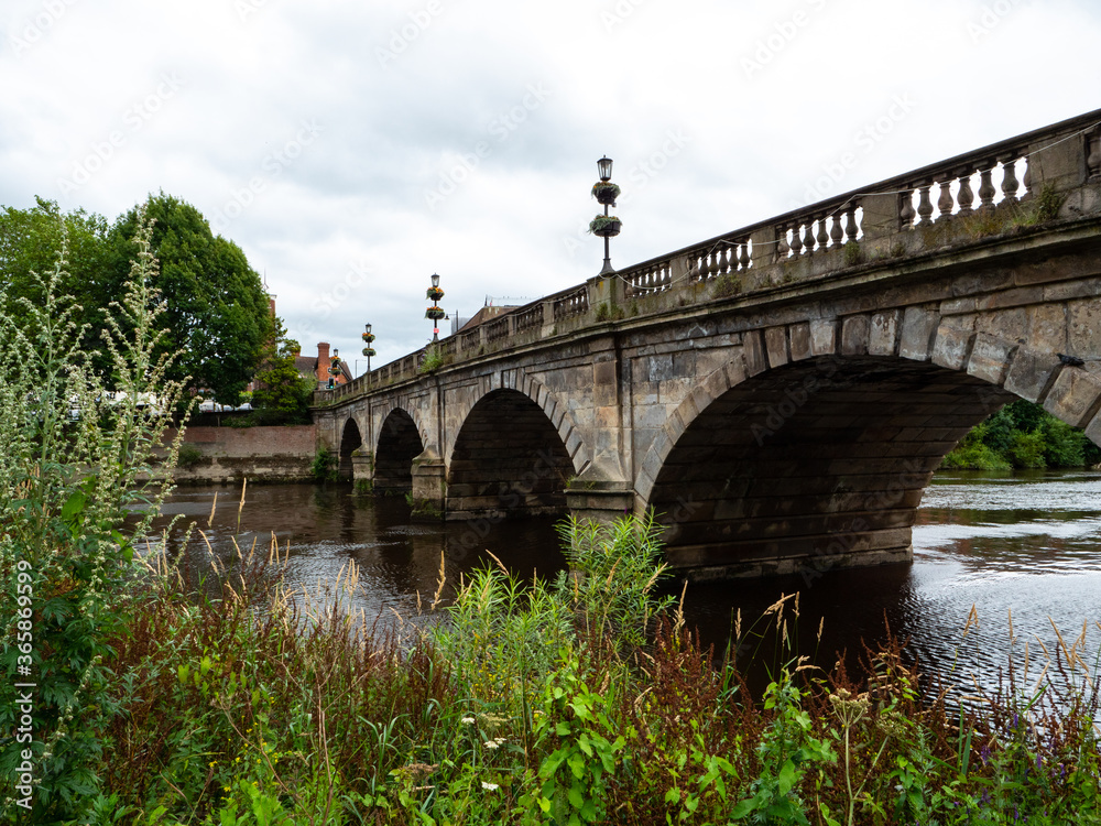 The 18th century Grade II listed 'Welsh Bridge' crosses the River Severn in Shrewsbury, UK.