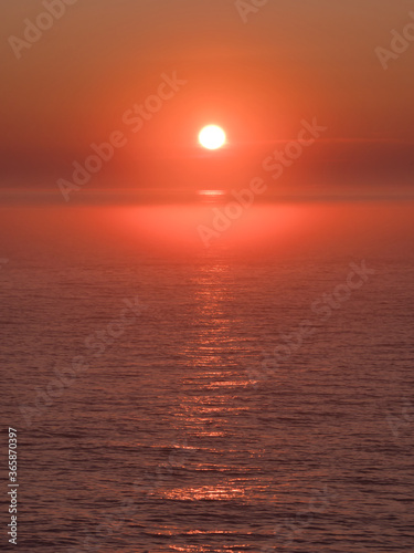 Orange red sunset over the sea © Bernard Chantal