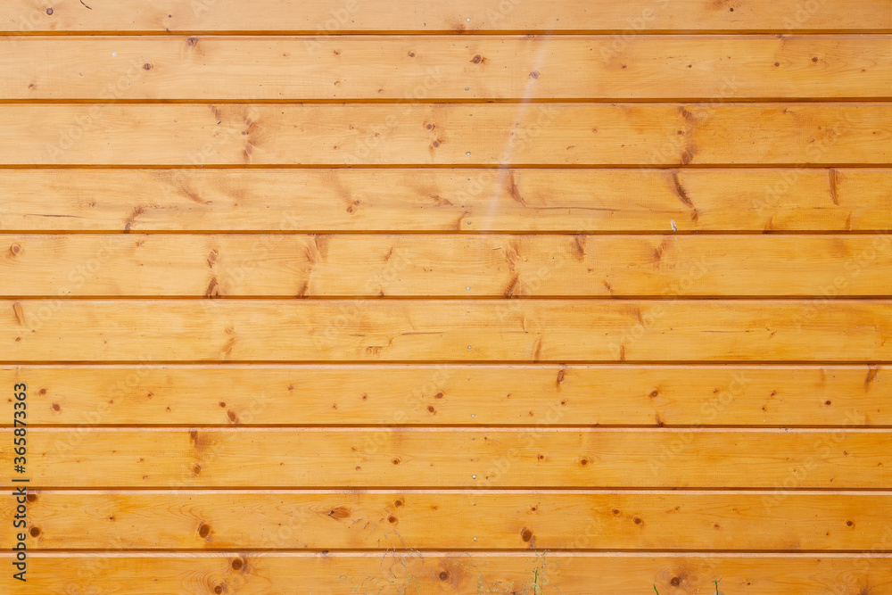 Fototapeta premium Yellow painted wood wall from planks. Background texture. Close up view
