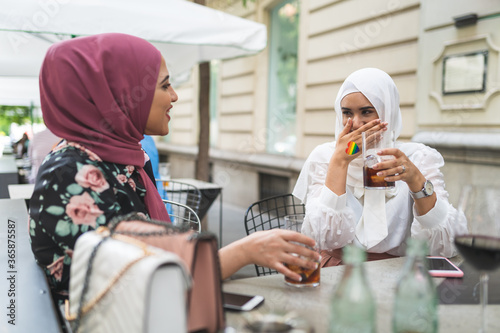 Bild auf Leinwand Beautiful Arab Girls Having fun Outdoors. Friendship Concept.