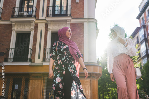 Bild auf Leinwand Beautiful Arab Girls Having fun Outdoors. Friendship Concept.