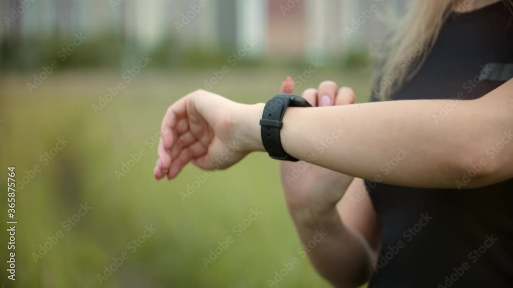 Fit Woman Checking Time On Smartwatch After Jogging.Girl Check Pulse On Fitness Bracelet.Athlete Girl.Girl Use Smart Watch.Runner Checking Pulse On Smartwatch After Running.Girl Using Fitness Bracelet Fit Woman Checking Time On Smartwatch After Jogging.Girl Check Pulse On Fitness Bracelet.Athlete Girl.Girl Use Smart Watch.Runner Checking Pulse On Smartwatch After Running.Girl Using Fitness Bracelet